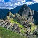 Explore the stunning ancient ruins of Machu Picchu, a UNESCO World Heritage Site in Peru, surrounded by majestic mountains.
